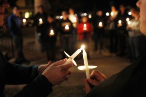 Members of Queer Advocacy Network join with St. Paul's Church of Christ Thursday evening for a candlelight vigil. Andy Carpenean/Boomerang photographer